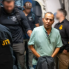 Khalid Ahmed Satary is escorted after his capture in connection with an alleged $547 million Medicaid fraud scheme. Photo: Federal Bureau of Investigation New Orleans / Used with Permission