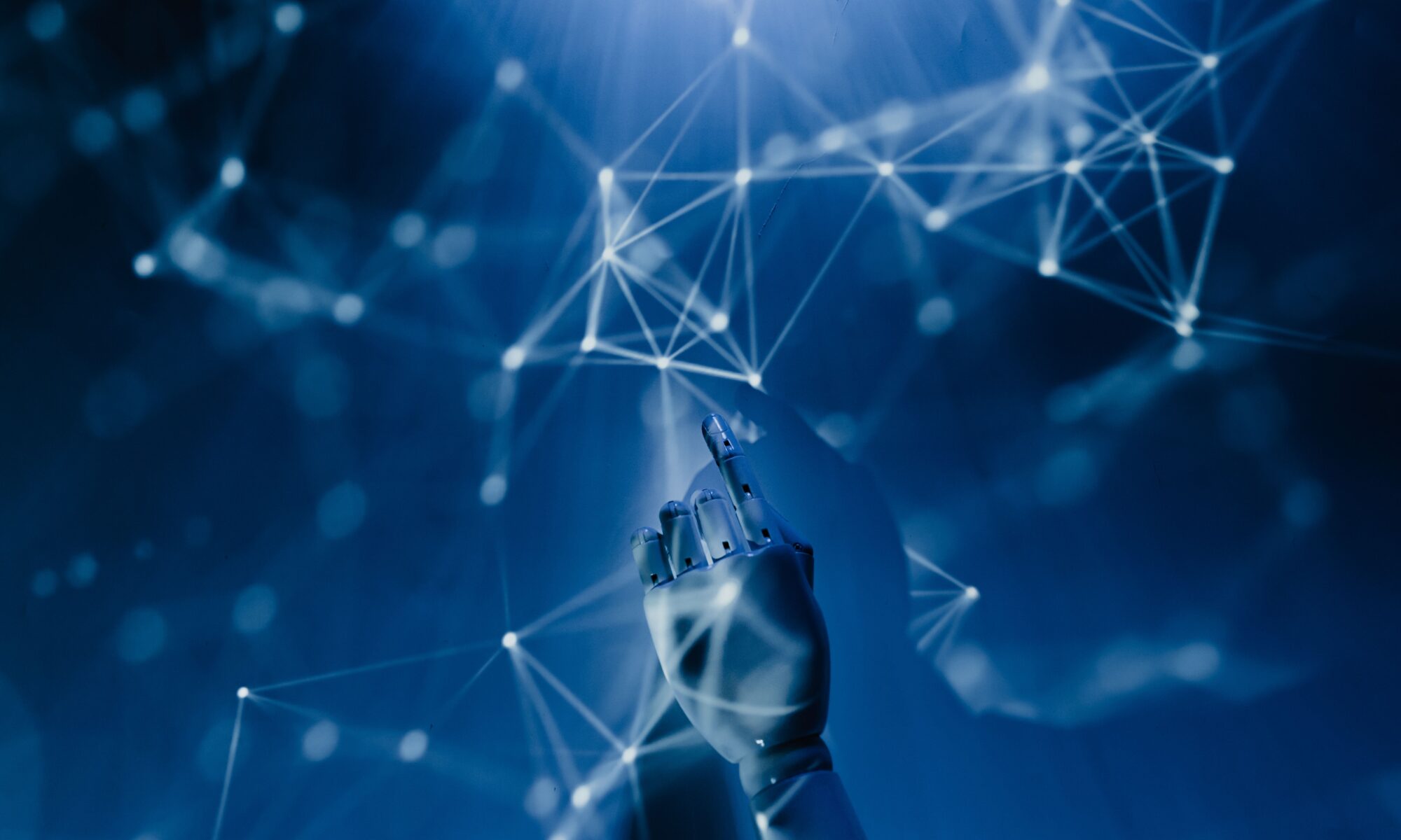 A robotic hand reaching into a digital network on a blue background, symbolizing AI technology.